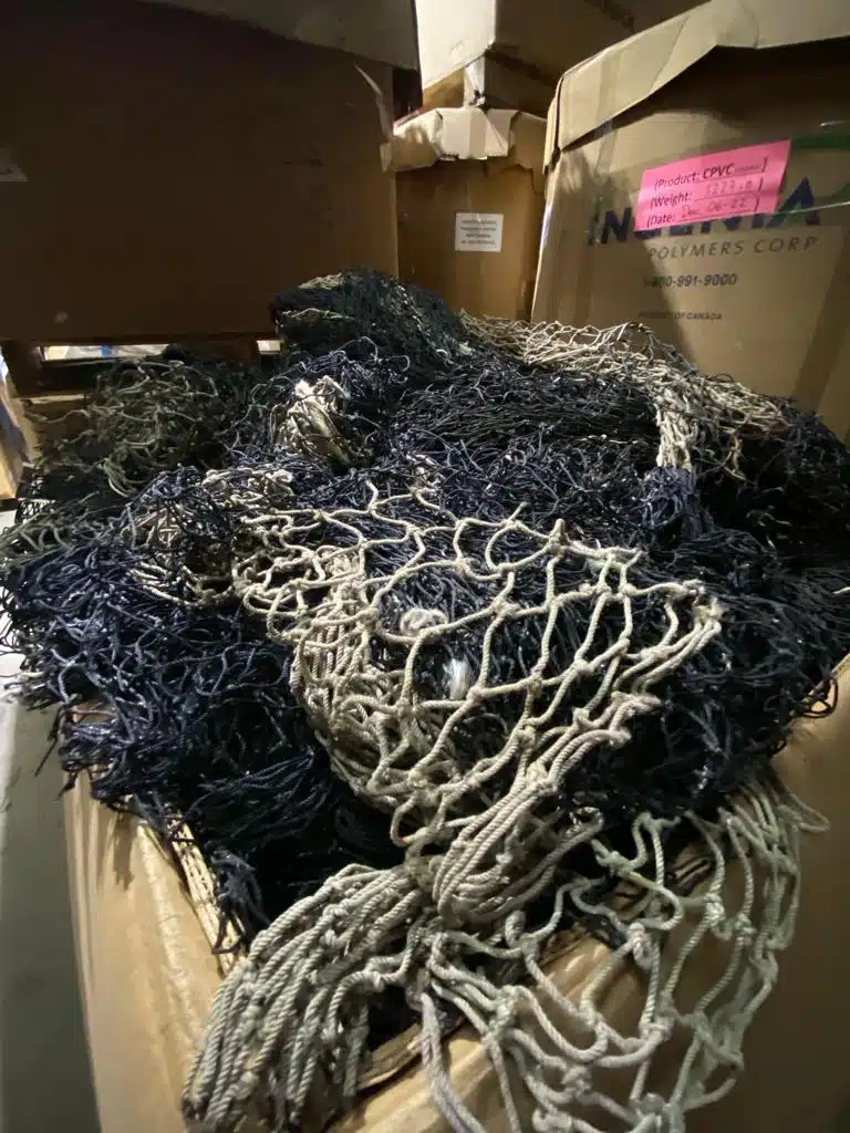 Piles of discarded fishing nets prepared for recycling at Reclaim Plastics.
